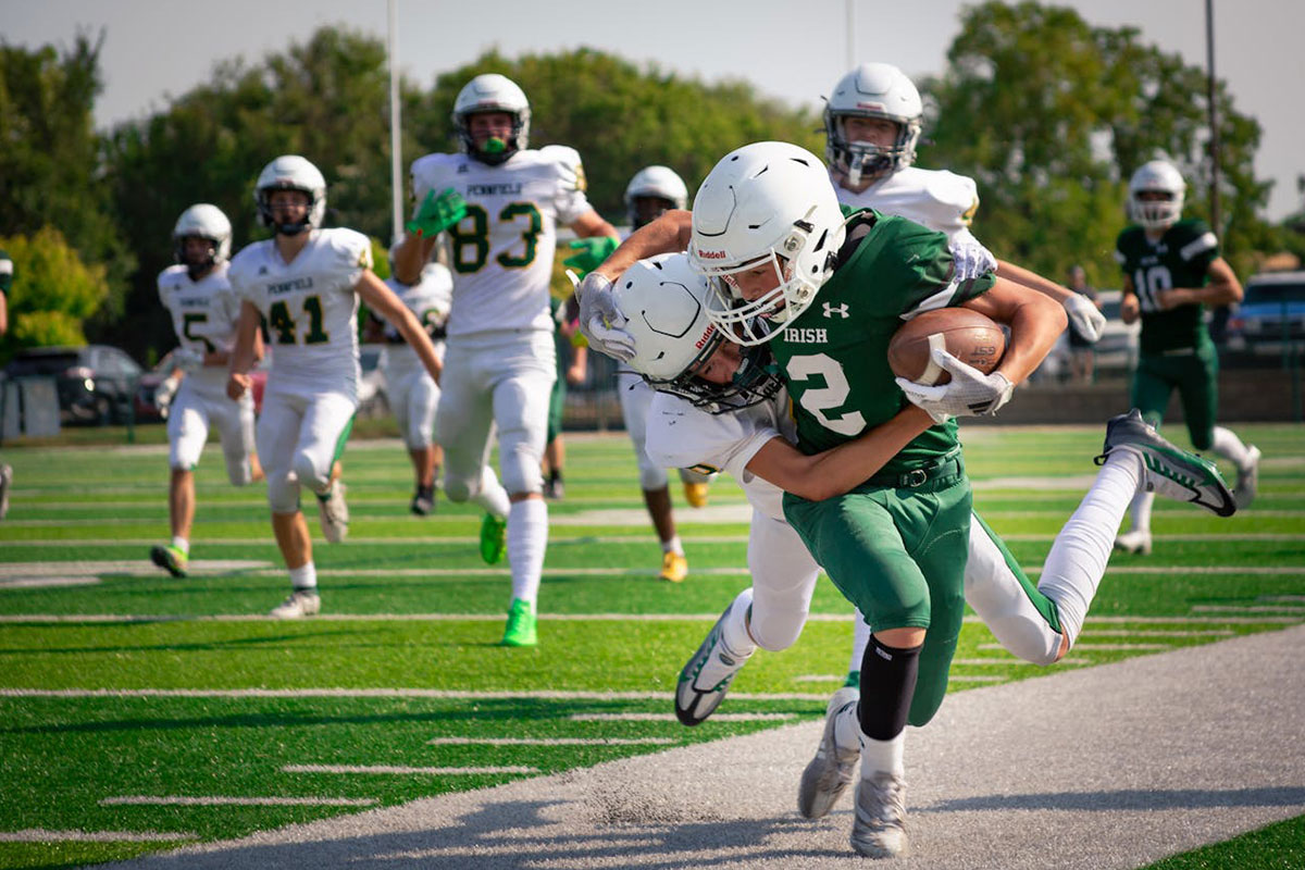 high school students playing American football