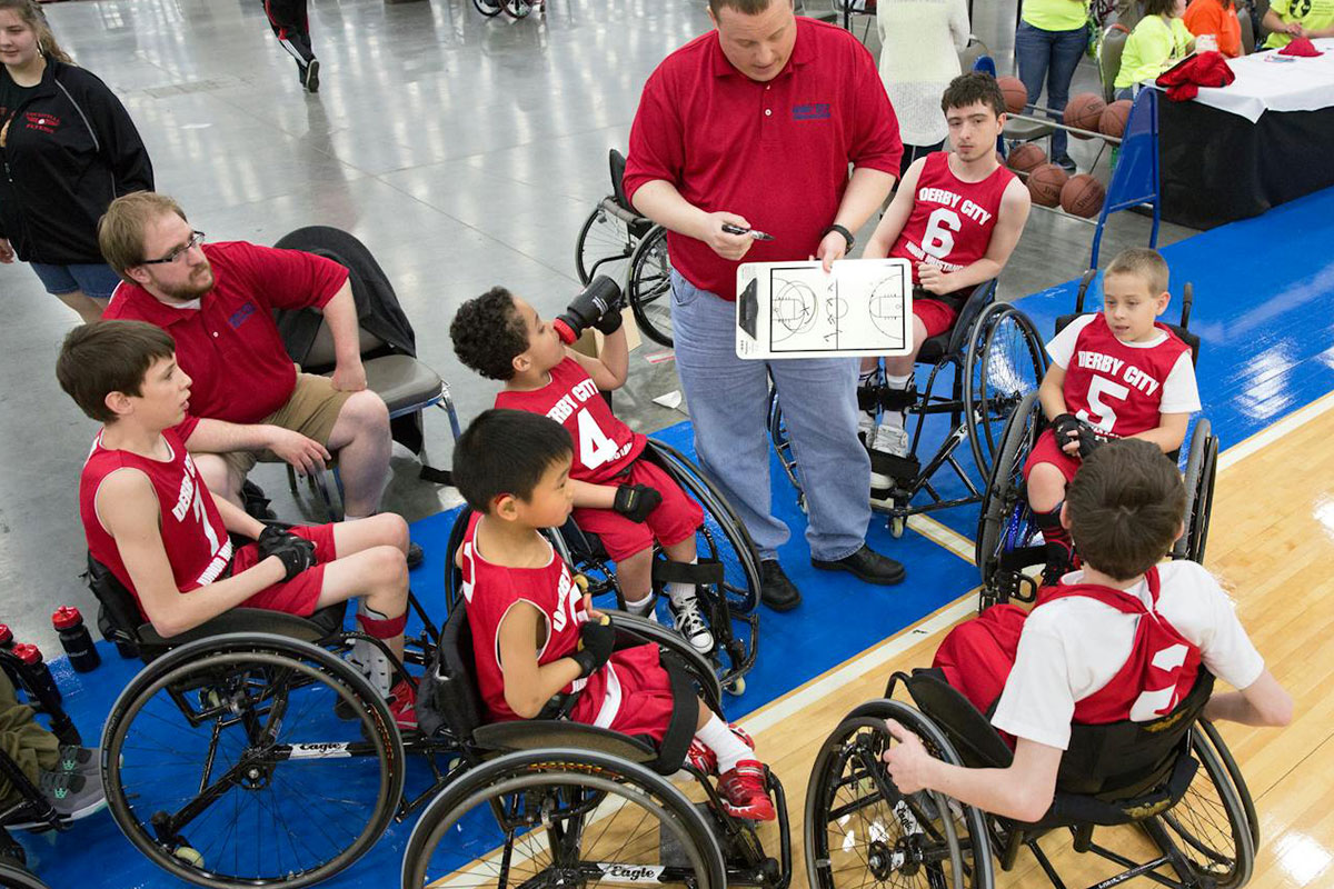 A sports team of children with disabilities in wheelchairs