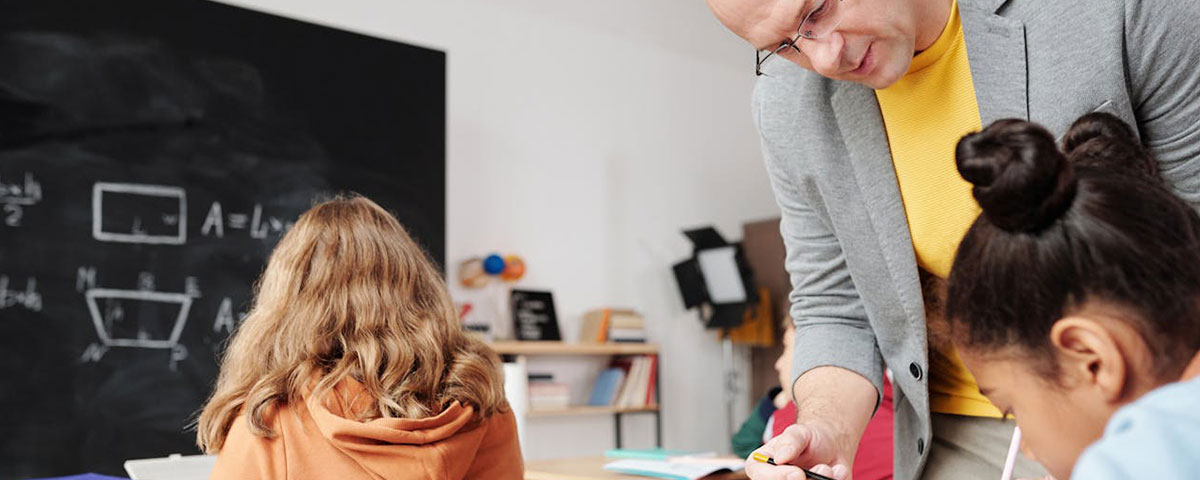 Teacher supervising students