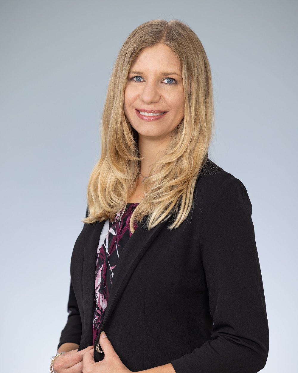 Professional headshot of Charlene Becker, Operations Manager of School Liability Expert Group, in a black blazer