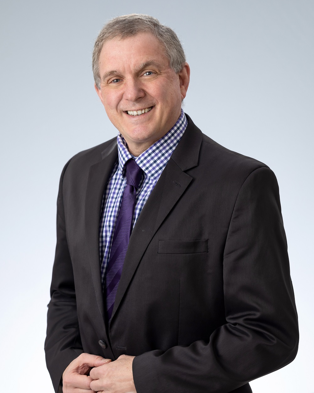 Professional headshot of John Doherty, education expert witness of School Liability Expert Group, in a formal suit.