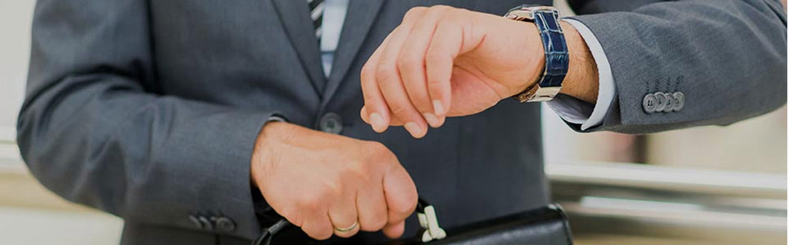 A lawyer looking at his watch.