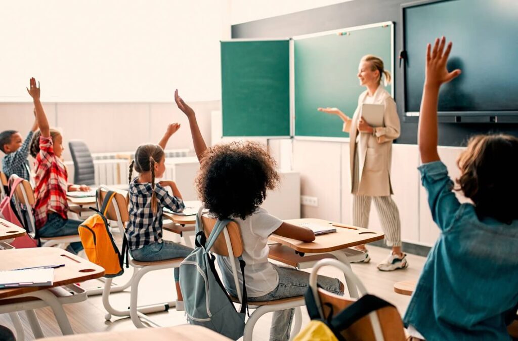 A teacher asking students a question.