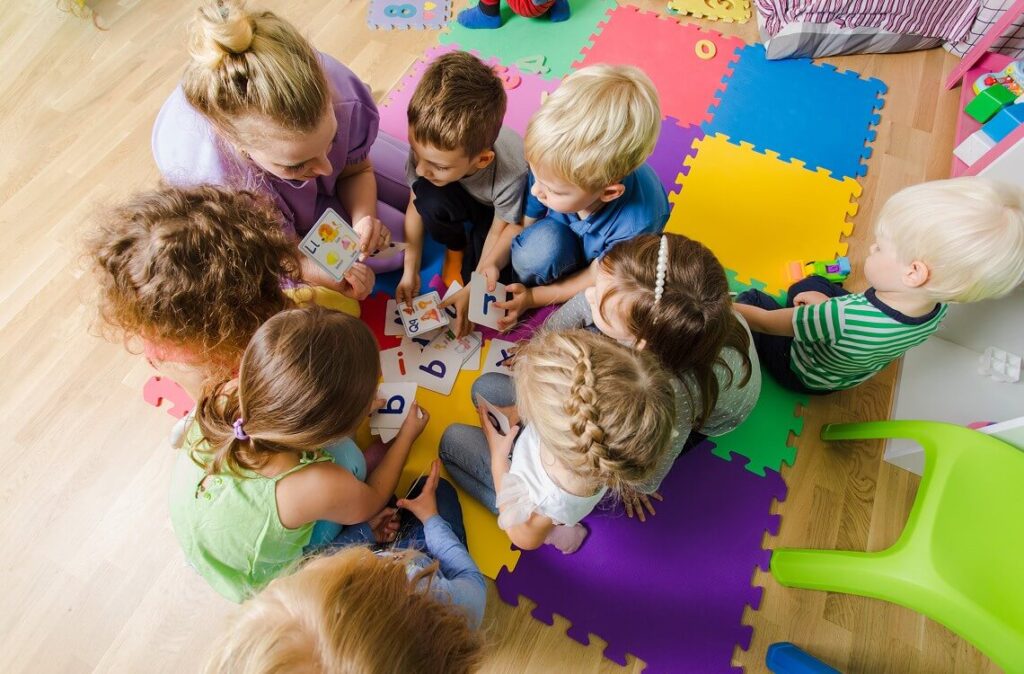 A daycare teacher with children