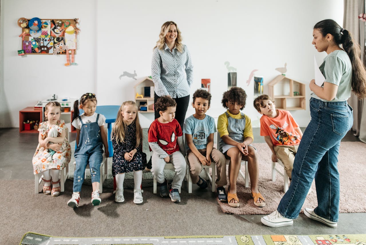 Adults supervising children outside a church