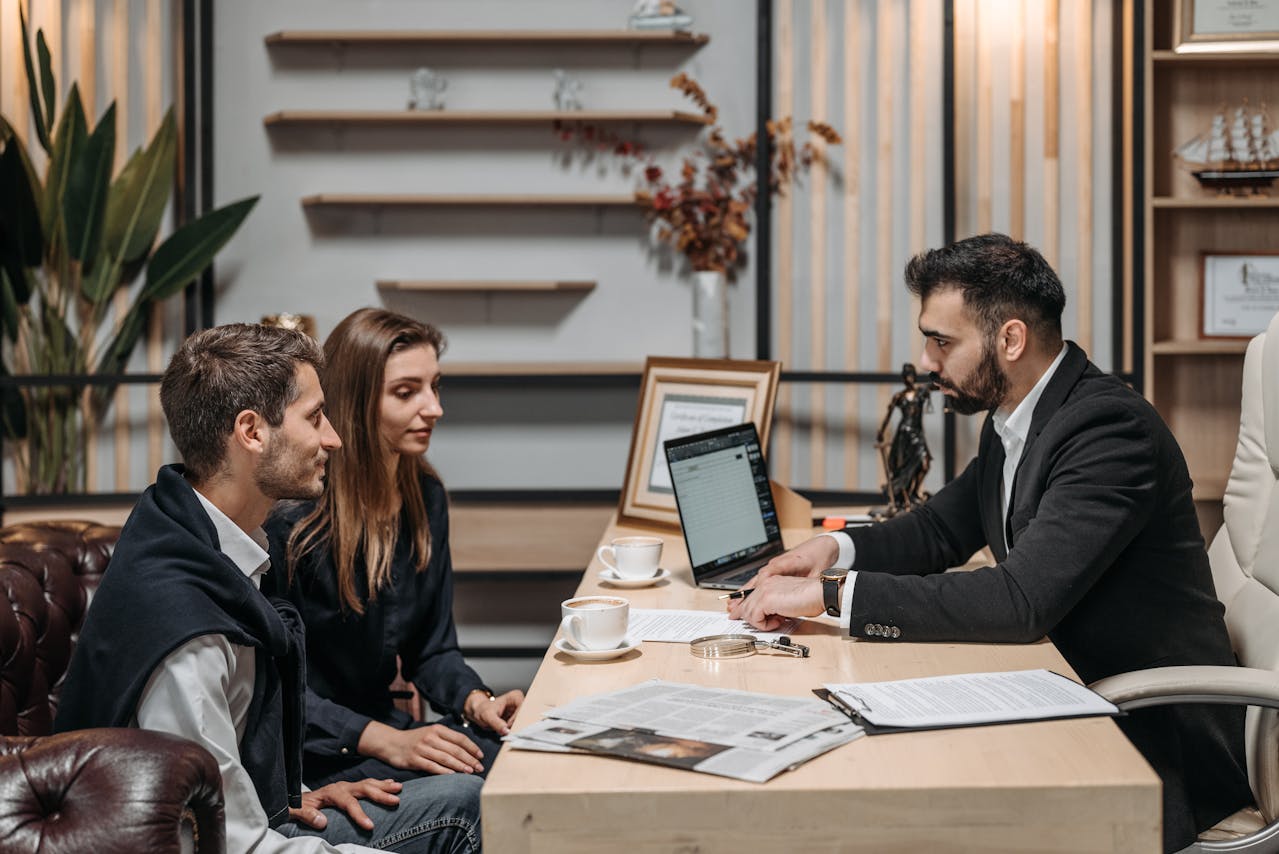 a couple consulting with an attorney