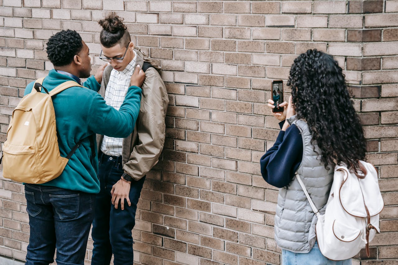 a student pinning another student against the wall