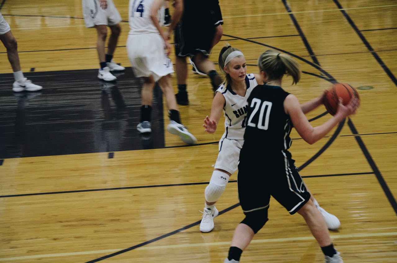 Women playing basketball
