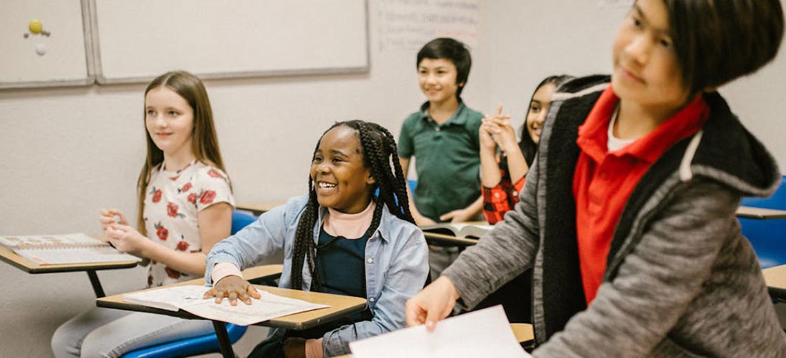 A diverse group of students in a classroom