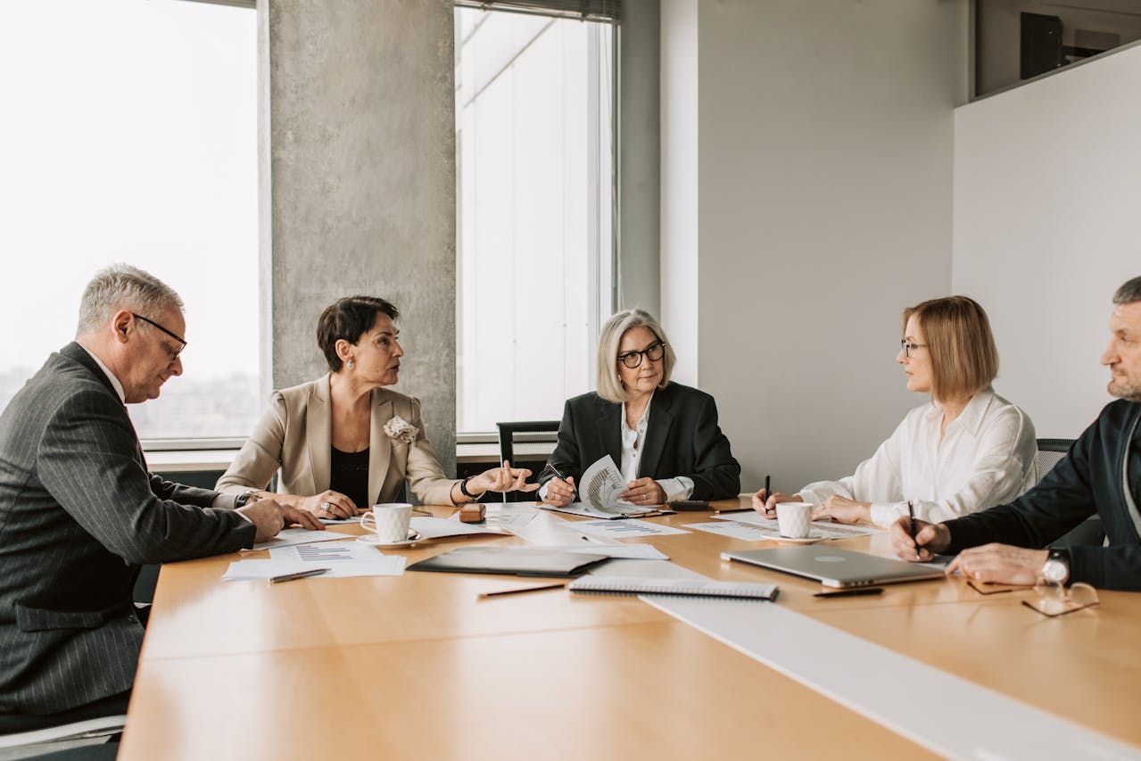 A group of people discussing in a room